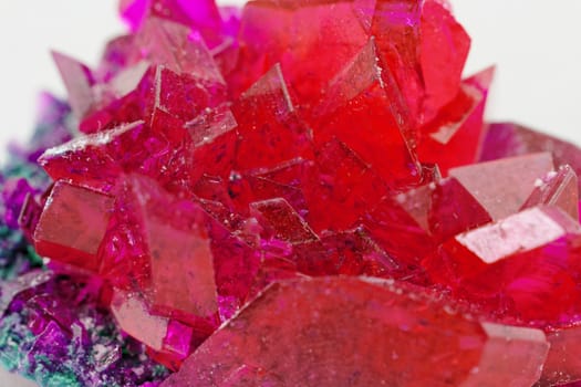 close up of crystals in ruby color on white background (red crystal)