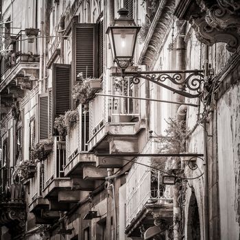 Beautiful vintage balcony and street lamp in mediterranean street