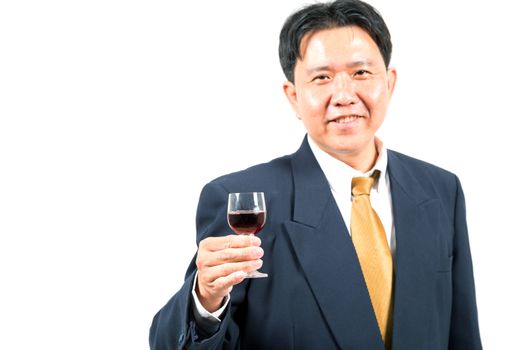 businessman with glass of wine (selective focus at glass)