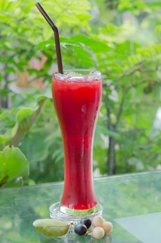 fresh karonda juice with ice  in glass,