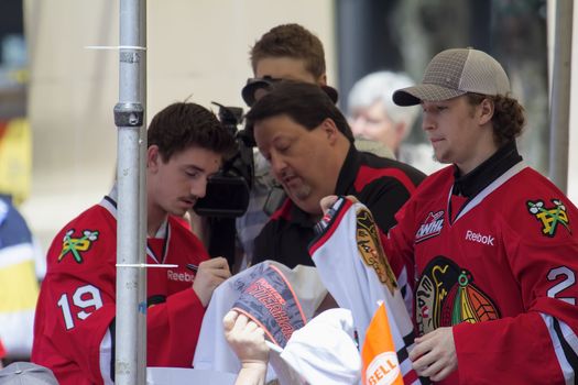 PORTLAND, OREGON - MAY 14: Portland Winterhawks Ice Hockey Team players signing autographs at Pioneer Square Rally on May 14, 2013, after winning the Western Hockey League Championship and bringing home the Ed Chynoweth Cup