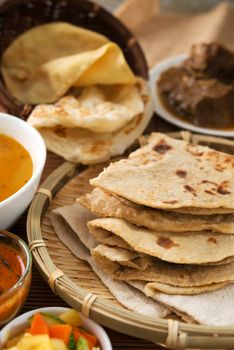 Chapati or Flat bread, Indian food, made from wheat flour dough. Roti canai and curry.