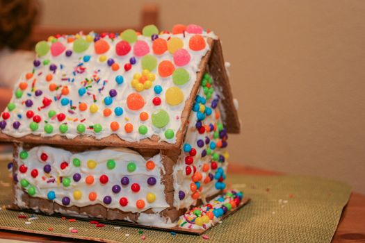 Making gingerbread house together at home before Christmas.