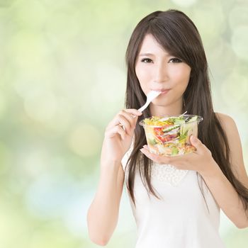 Asian beauty eat salad, closeup portrait.