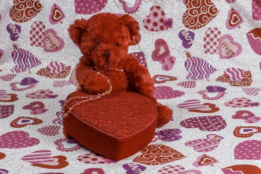 A red bear and heart create a colorful Valentine's Day theme.