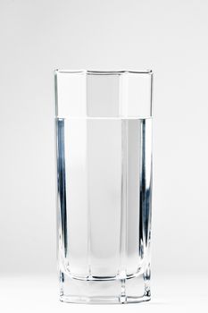 With a glass of water on a white background