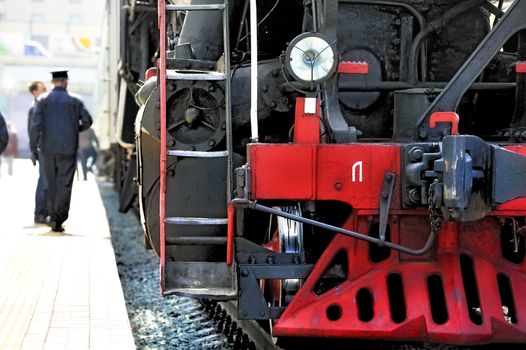 Old Russian steam locomotive on the platform