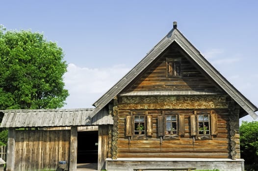 Village house with a small yard.