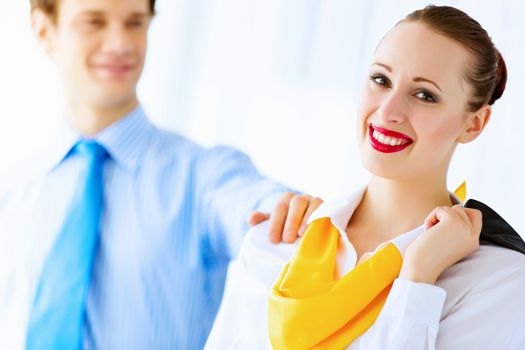 Image of businessman and businesswoman smiling joyfully