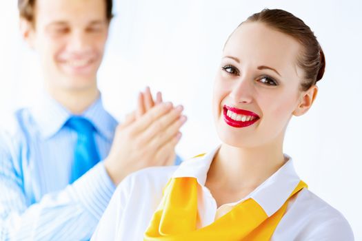 Image of businessman and businesswoman smiling joyfully