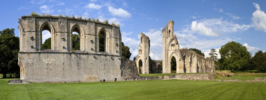 Panoramic view of the historic ruins of Glastonbury Abbey in Somerset, England.