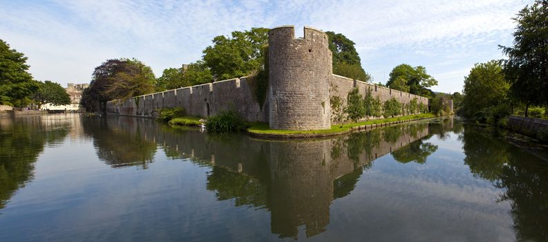 Panoramic view of the Bishop's Palace and Moat in Wells, Somerset.