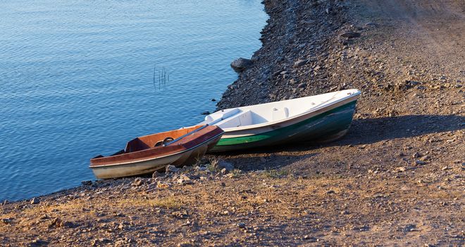 Parking of boats on the seashore on suset