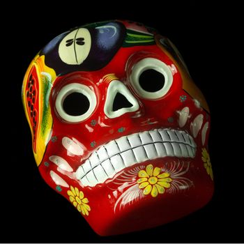 Colorful painted Day of The Dead (Dia de los Muertos) skulls isolated on black background