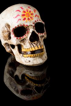 Hand painted Dia de los Muertos (Day of The Dead) skull isolated on black background