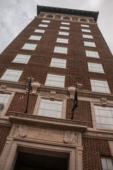 Historic brick Chamber of Commerce Building in  downtown Greenville, South Carolina. Dramatic clouds and slightly skewed perspective