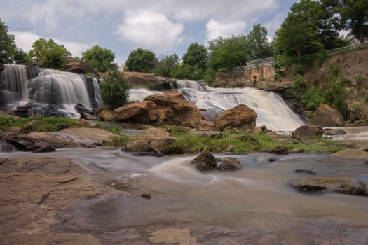 Long exposure captures the slow flowing Reedy River at Falls Park