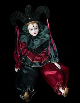 Mardi Gras doll clown isolated on black background