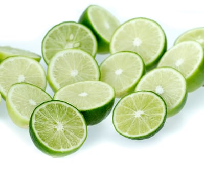 cut limes on white background