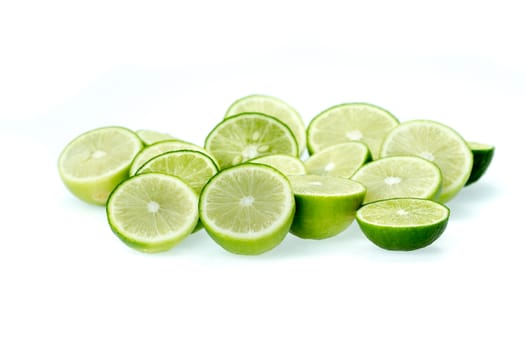 cut limes on white background