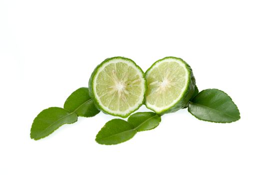 kaffir lime cut with leaf isolated on white