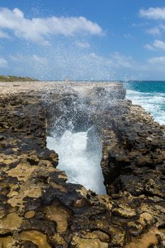 Waves Crashing through Rocky Opening in Devil's Bridge Antigua