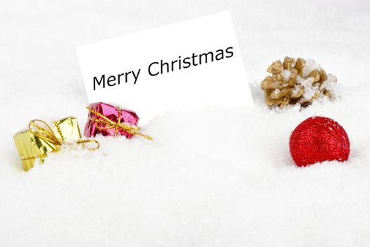 Blank white card with christmas decoration in the snow