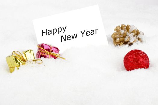Blank white card with christmas decoration in the snow