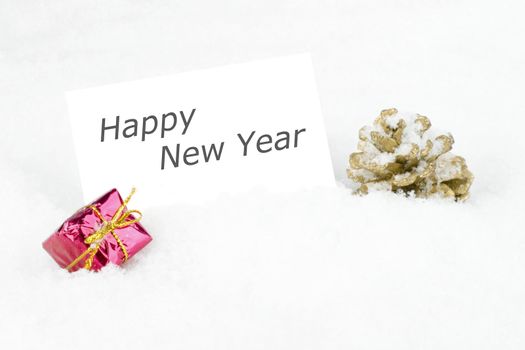 Blank white card with christmas decoration in the snow