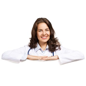 Young attractive female doctor put her hands on the blank banner, place for text