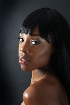 A close-up of an extraordinarily beautiful young black woman with amazingly captivating eyes.