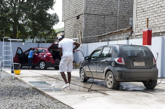 People who wash by hand a automolbile