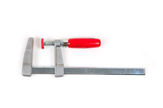 Metal vice with red handle on white background