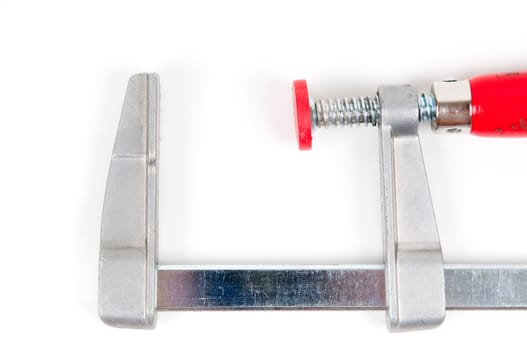 Metal vice with red handle on white background