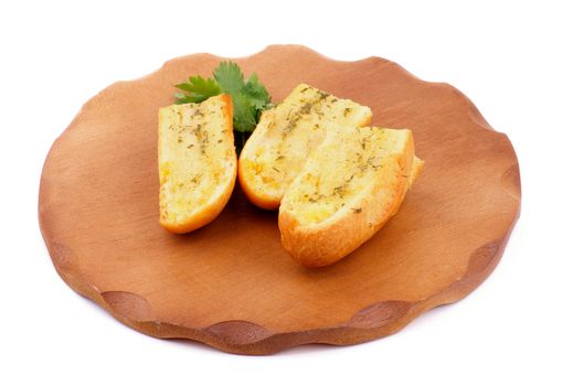 Arrangement of Three Slices of Garlic and Herb Bread on Wooden Cutting Board isolated on white background