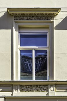 window on the outside wall of a historic building