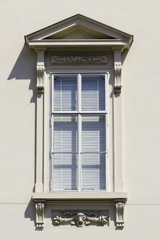 Image of a window with closed jalousi