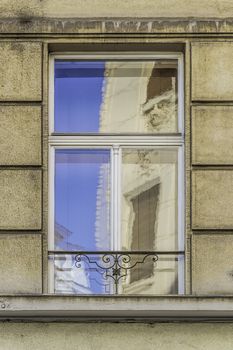 Image of a window with reflection on a old building