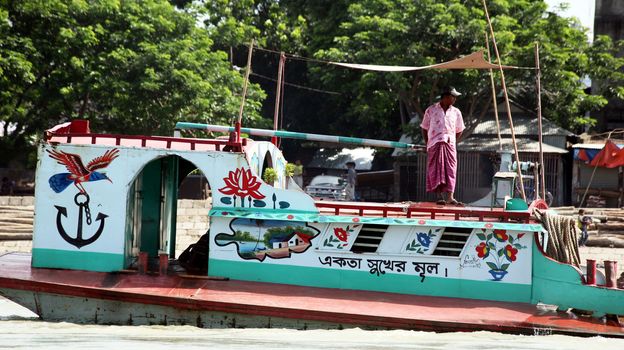 Busy river traffic on Buriganga in Dhaka, capital of Bangladesh. July 9, 2010. The strongly polluted arm of the Padma river in the Ganges-Brahmaputra river delta is an economically important arteria for the city.