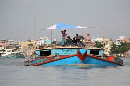 Busy river traffic on Buriganga in Dhaka, capital of Bangladesh. July 9, 2010. The strongly polluted arm of the Padma river in the Ganges-Brahmaputra river delta is an economically important arteria for the city.