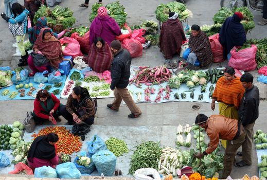 Pavement vegetable market on Darbar (Durbar) Square, Kathmandu, Nepal. December 27, 2012. The market serves small retailers of vegetable as a source of income.