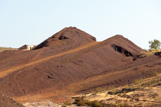 Copper mine tailings or refuse heaps remaining at a mine after the ore has been processed