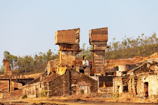 Abandoned copper mine with old stone buildings 