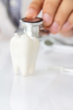 molar with dentist background ,dental concept