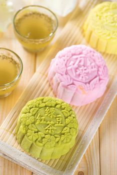 Snowy skin mooncakes.  Traditional Chinese mid autumn festival food. The Chinese words on the mooncakes is green tea with red bean paste, noble delight and lotus paste, not a logo or trademark.