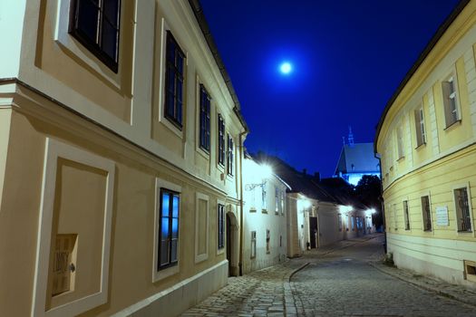 deserted street of Bratislava at night in a full moon