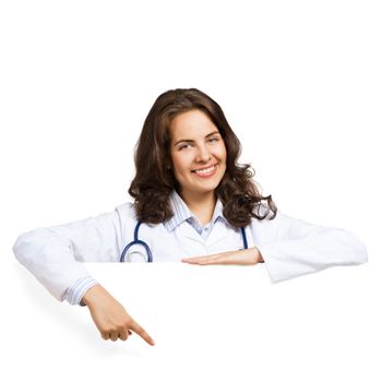 Young attractive female doctor put her hands on the blank banner, points at a place for text