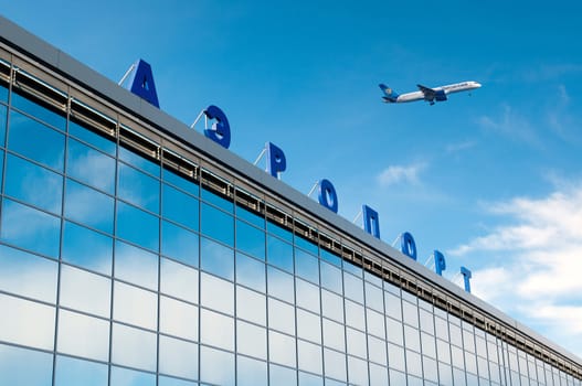 The modern russian airport with airplane over it