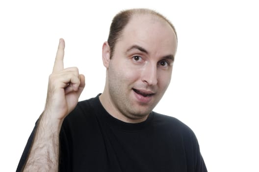 young man with an idea pointing upwards with his finger on white background