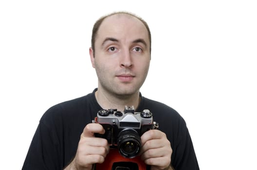 portrait of a young man holding a vintage camera on white background